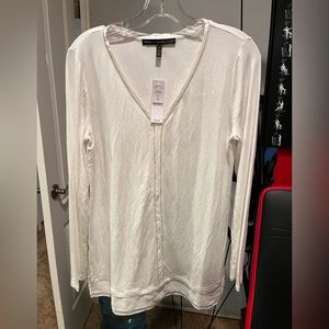White House Black Market long sleeve top. Silver trim and lace bottom.